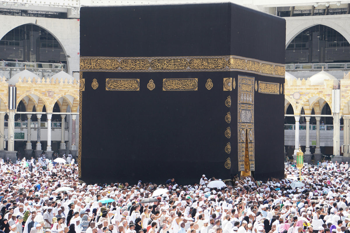 Pilgrims around the Kaaba at sunset